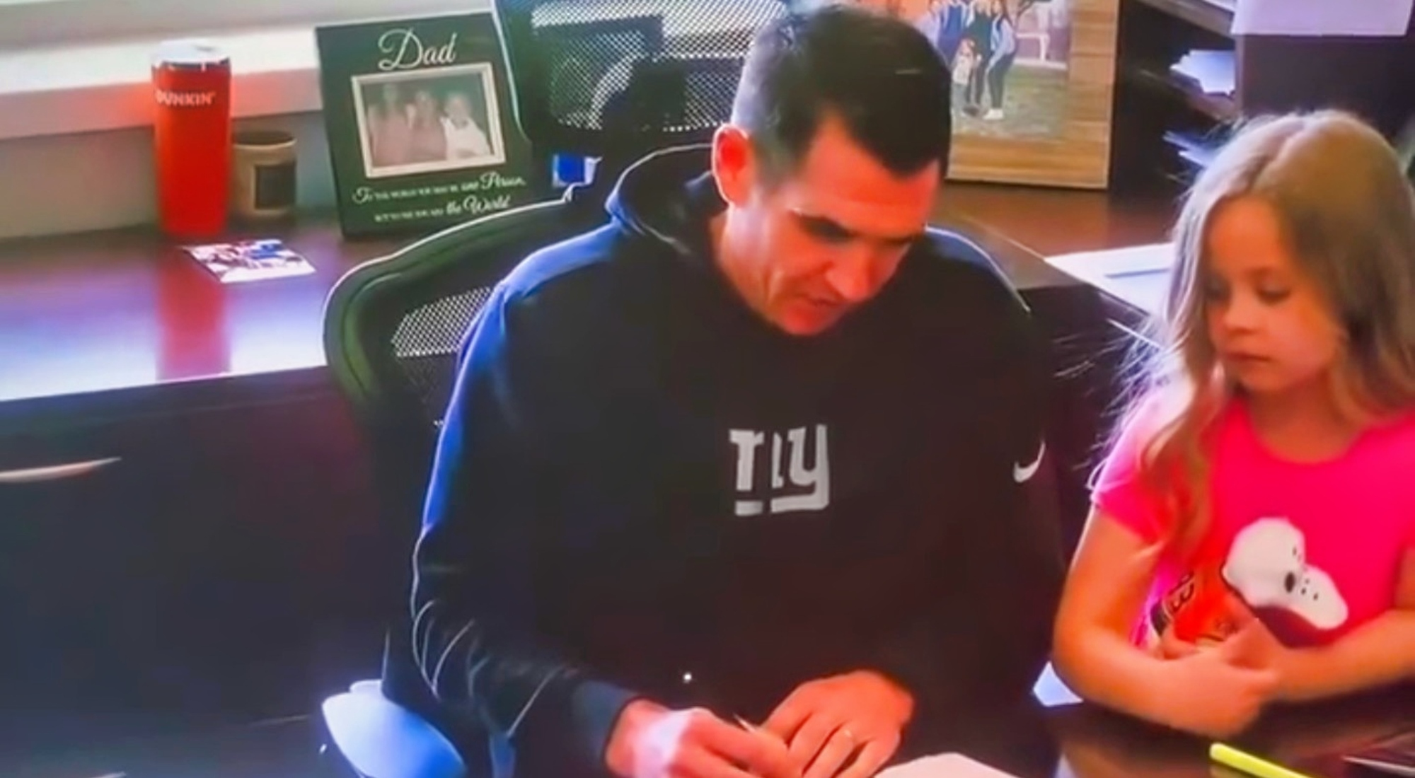 New York Giants GM Joe Schoen and his daughter at his desk during an episode of HBO's Hard Knocks.