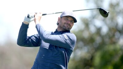 Mardy Fish playing golf at ACC Championship golf tournament