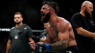 Mike Perry celebrates after defeating Alex Oliveira