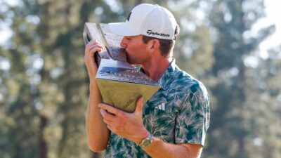 Nick Dunlap kissing the Barracuda Championship trophy