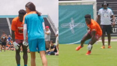 Tyreek Hill lining up against young girl on field