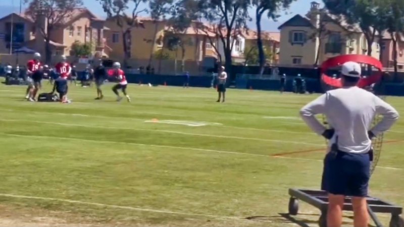 Dallas Cowboys quarterbacks Dak Prescott and Trey Lance practicing accuracy drill.