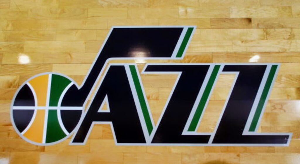 Utah Jazz logo on the court. The team is working to trade young star player Walker Kessler.