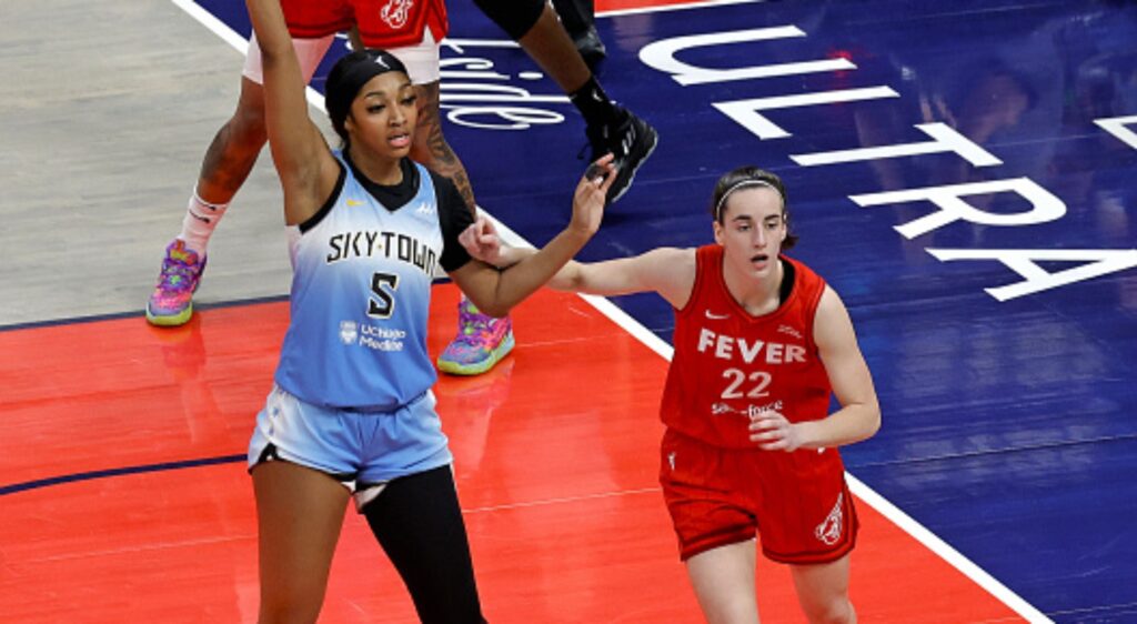 Angel Reese and Caitlin Clark battle it out during a game.