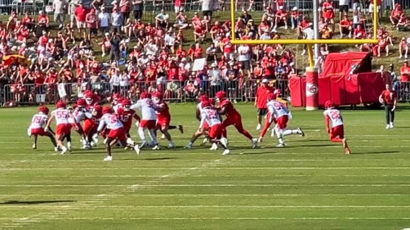 Kansas City Chiefs players running a drill during practice.