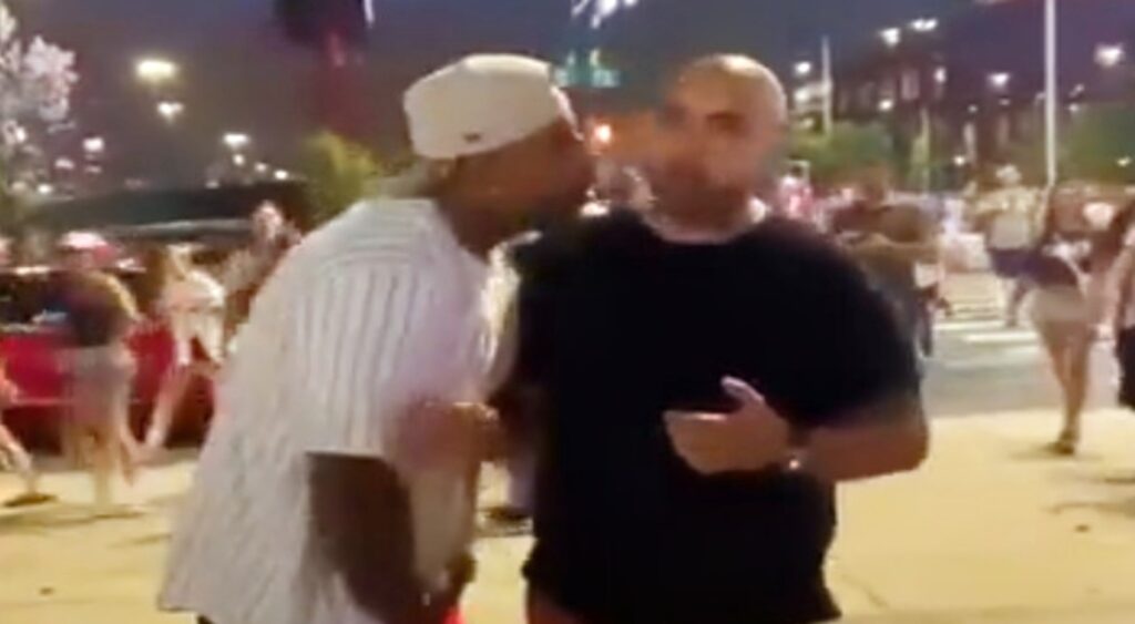 New York Yankees and Philadelphia Phillies fan arguing outside ballpark.