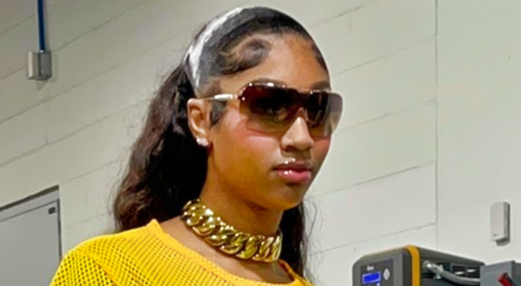 Angel Reese wearing yellow top and sunglasses