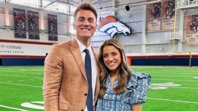 Bo Nix and Izzy Nix posing at Broncos facility