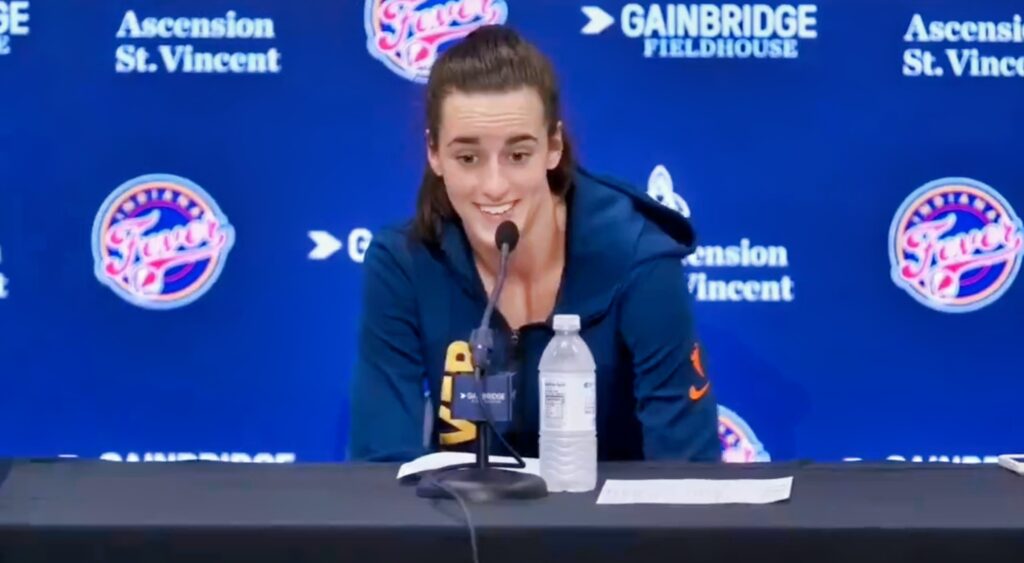 Caitlin Clark speaks at a press conference.