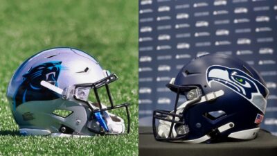 Carolina Panthers and Seattle Seahawks helmets on ground and table