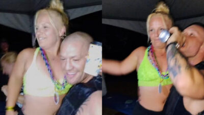 Photo of Conor McGregor with girl surfaces