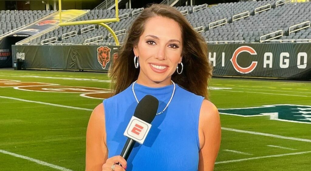 Courtney Cronin holding microphone on Bears football field