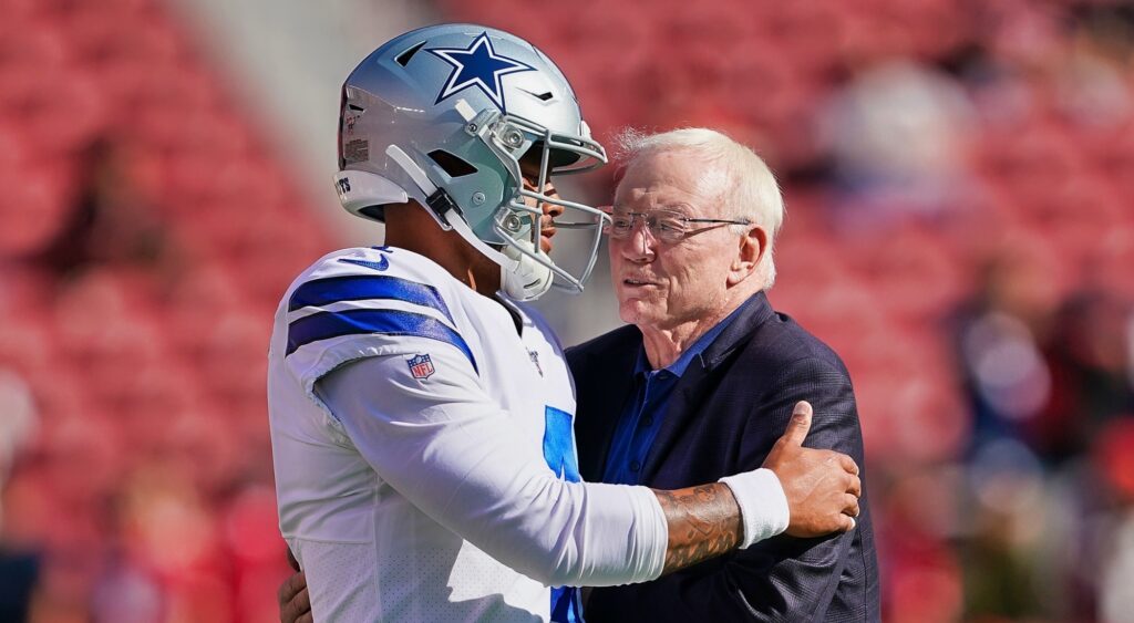 Dak Prescott speaking to Dallas Cowboys owner Jerry Jones.