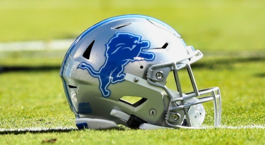 Detroit Lions helmet shown on field. Former offensive lineman Gosder Cherilus was arrested on a flight.