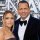 Alex Rodriguez and Jennifer Lopez posing in black outfits