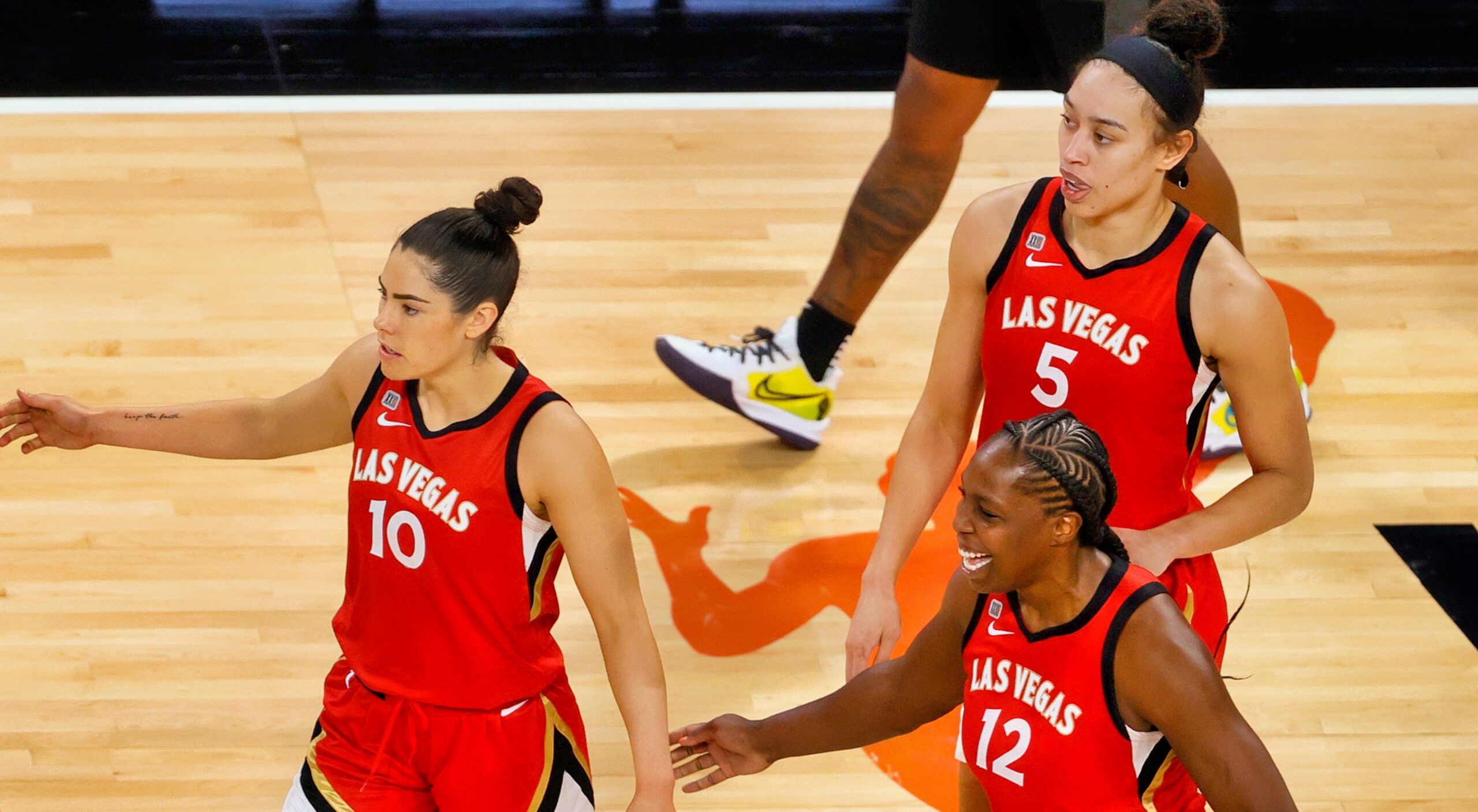 Kelsey Plum, Dearica Hamby and Chelsea Gray during a Las Vegas Aces game.