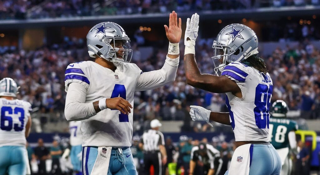 Dak Prescott and CeeDee Lamb of Dallas Cowboys celebrating a play.