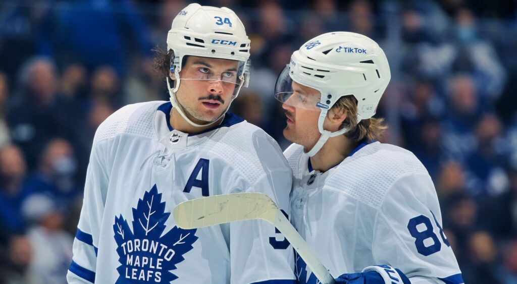 Auston Matthews and William Nylander of Toronto Maple Leafs talking during game.