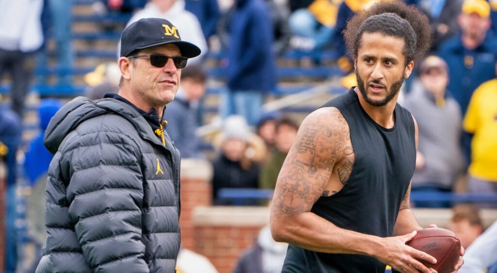 Colin Kaepernick interacts with Michigan Wolverine head coach Jim Harbaugh on field