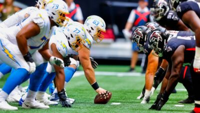 Chargers and Falcons players at line of scrimmage