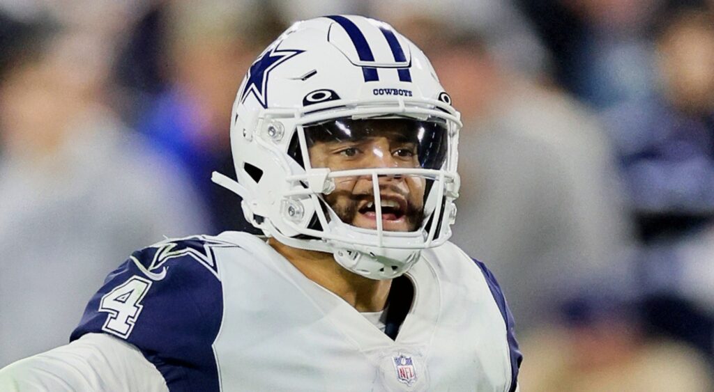 Dak Prescott of Dallas Cowboys looking on.