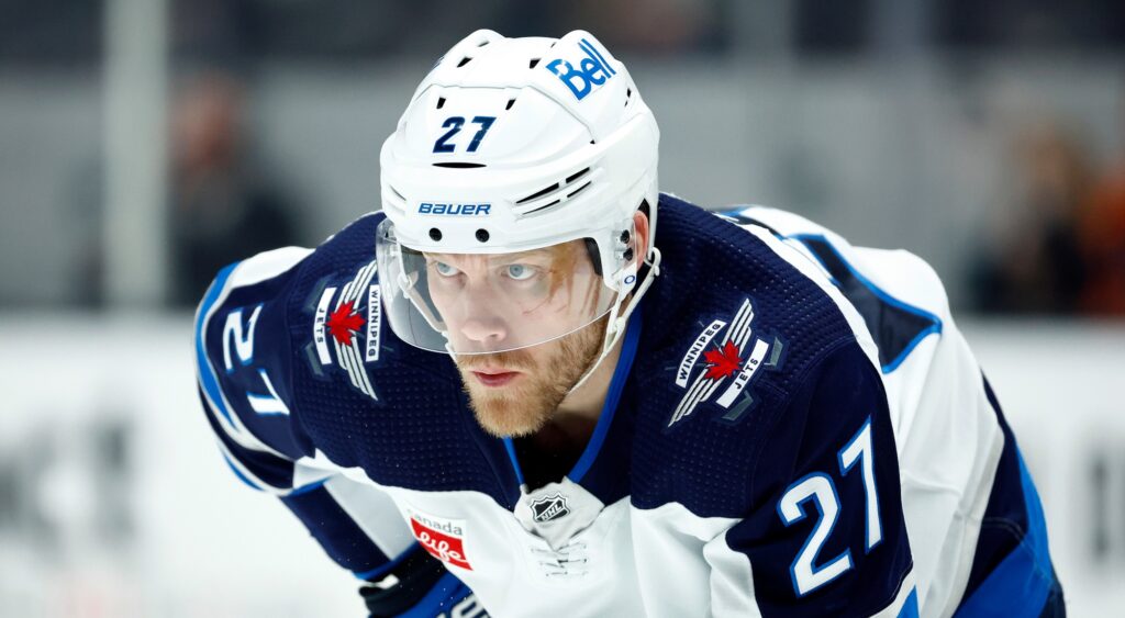 Nikolaj Ehlers of Winnipeg Jets looking on.