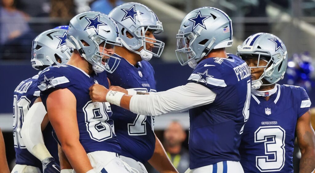 Dallas Cowboys players celebrating a touchdown.