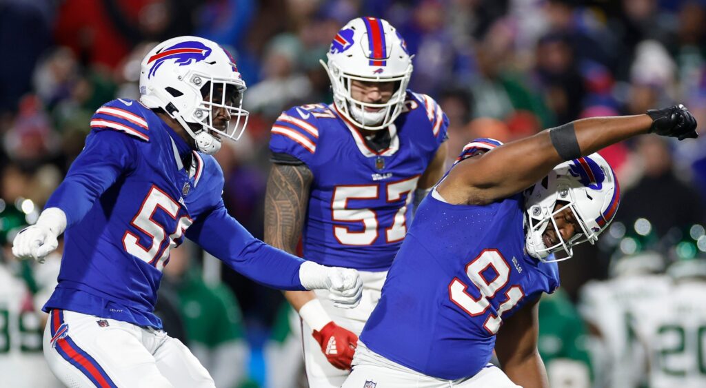 Buffalo Bills players celebrating a sack.