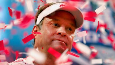 Lane Kiffin surrounded by confetti