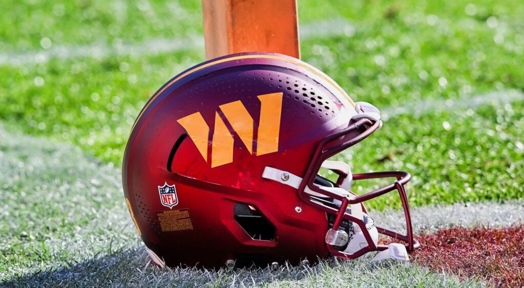 Washington Commanders helmet on the field. The team is getting called out after sending a message to FA punter Drue Chrisman.