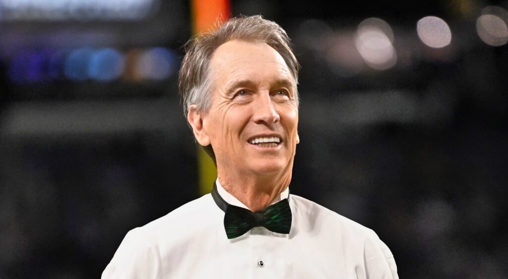 Cris Collinsworth of NBC looking on.