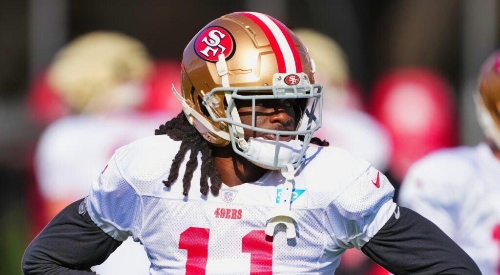 Brandon Aiyuk of San Francisco 49ers looking on.