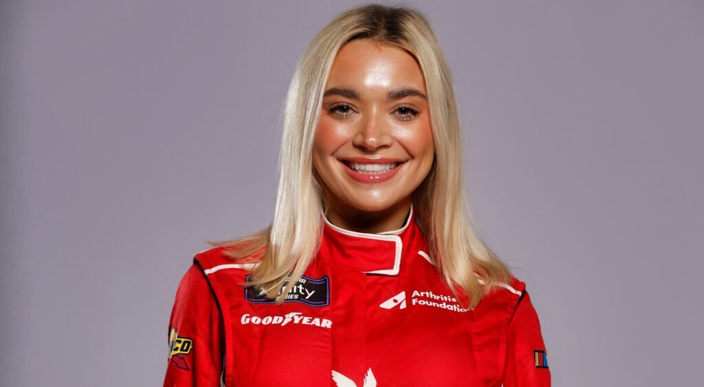 Natalie Decker smiling in NASCAR gear