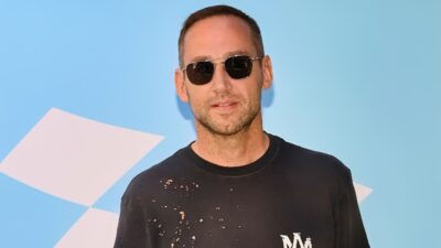 Michael Rubin posing in sunglasses and black shirt