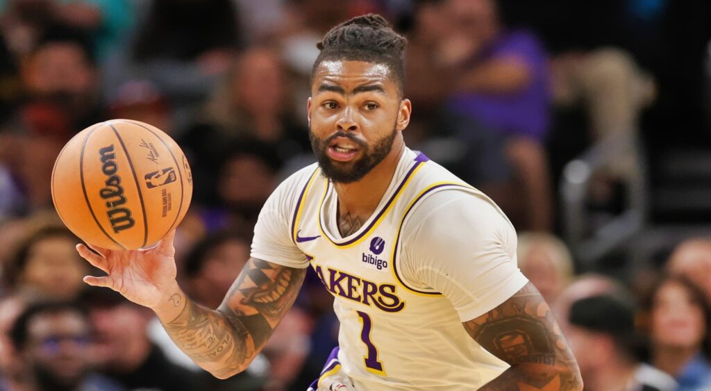 D'Angelo Russell of Los Angeles Lakers dribbling basketball.