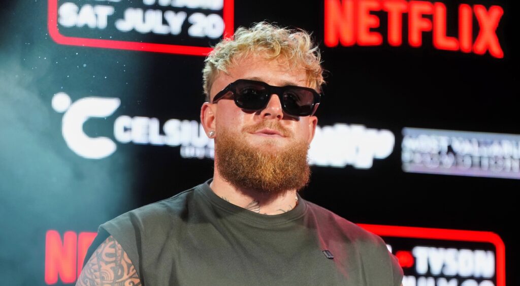 Jake Paul looking on at press conference.