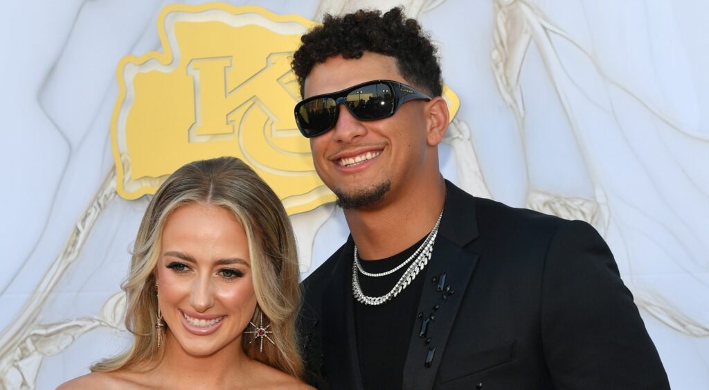 Patrick Mahomes and Brittany Mahomes posing