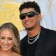 Patrick Mahomes and Brittany Mahomes posing