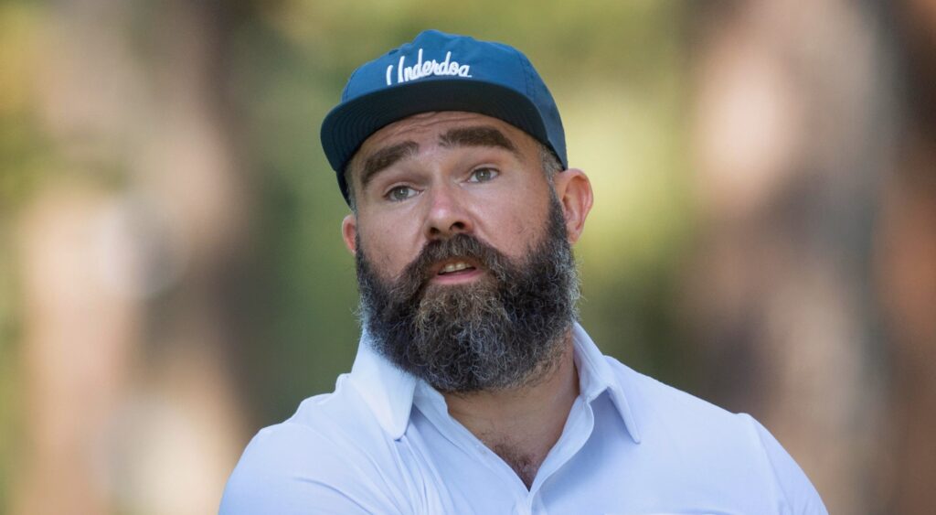 Jason Kelce looking on during golf event.