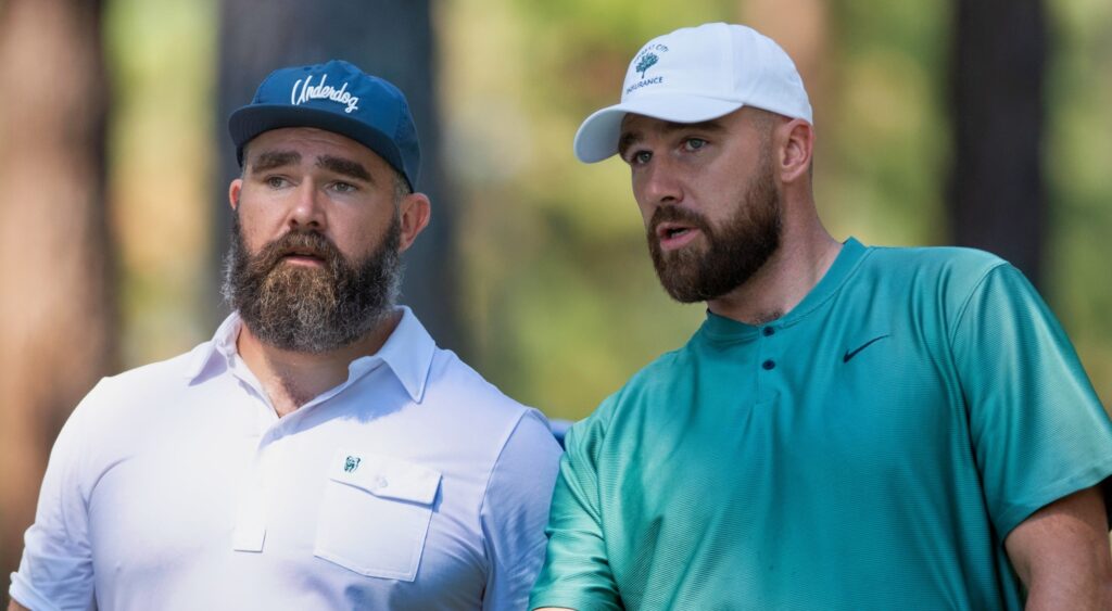 Jason Kelce and Travis Kelce speaking at golf event.