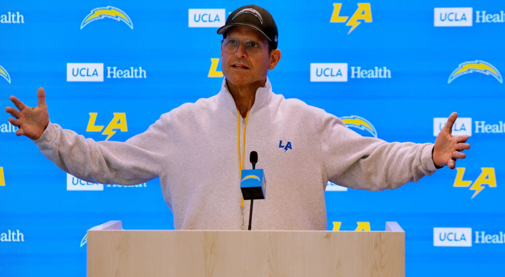 Jim Harbaugh speaking on podium