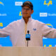 Jim Harbaugh speaking on podium