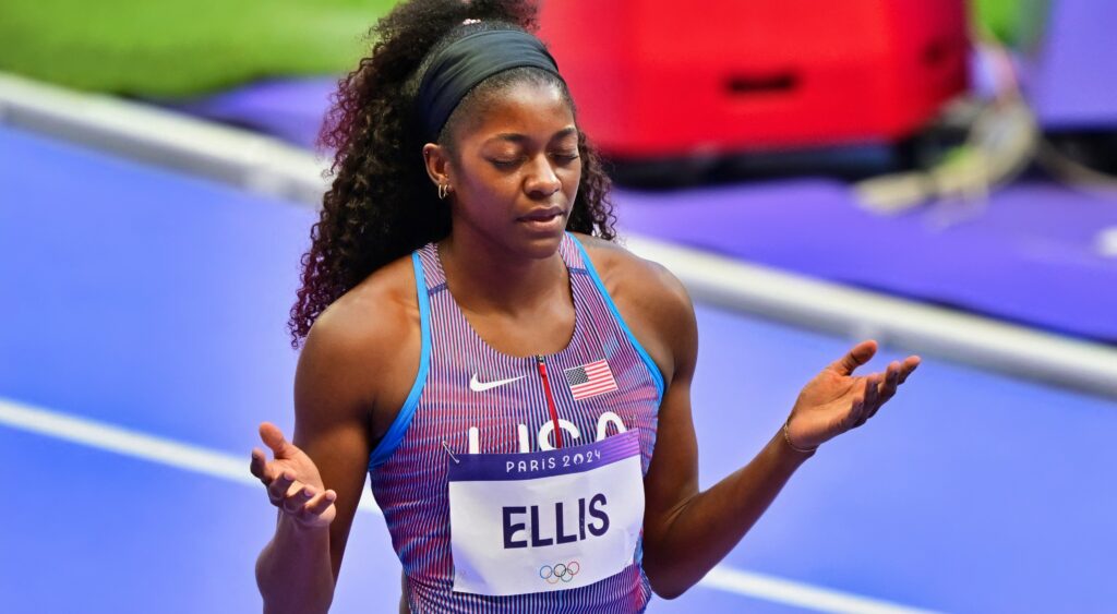 Kendal Ellis holds her hands out before a race at the Olympics.