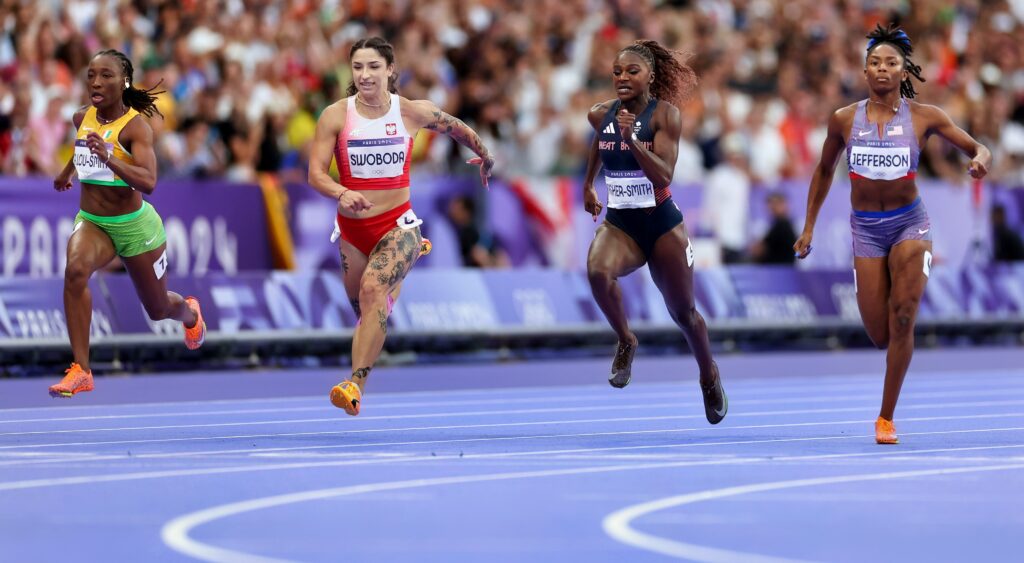 Marie-Josee Ta Lou-Smith of Team Cote D'Ivoire Ewa Swoboda of Team Poland, Dina Asher-Smith of Team Great Britain and Melisa Jefferson of Team United States