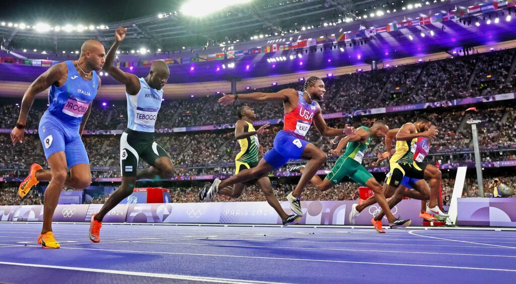 Noah Lyles crosses the line first in the 100 meter finals