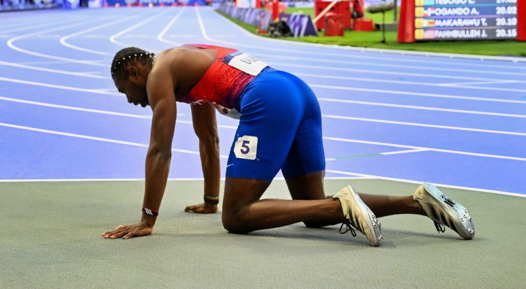 Noah Lyles crawling on ground