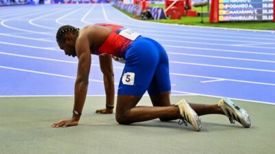 Noah Lyles crawling on ground