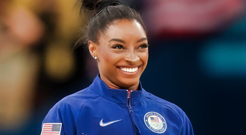 Simone Biles smiling at the Olympics