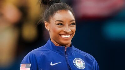 Simone Biles smiling at the Olympics