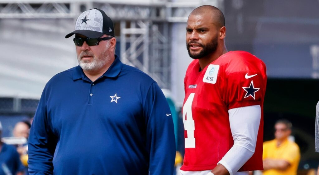 Dak Prescott looks on during practice with Mike McCarthy.